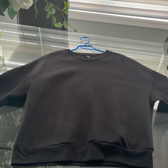 This is a black crewneck sweatshirt from shein size large US. - Picture 3 of 4